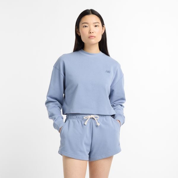 Bluza damska New Balance WT51514DUS – niebieska. Niebieskie bluzy damskie New Balance, s, z aplikacjami, z bawełny, bez kaptura. Za 249.99 zł.