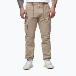 Spodnie męskie Pitbull Proctor Drawstring Joggery Cargo. Brązowe spodnie sportowe męskie PITBULL, m, bez wzorów, z bawełny, na fitness i siłownię. Za 229.99 zł.
