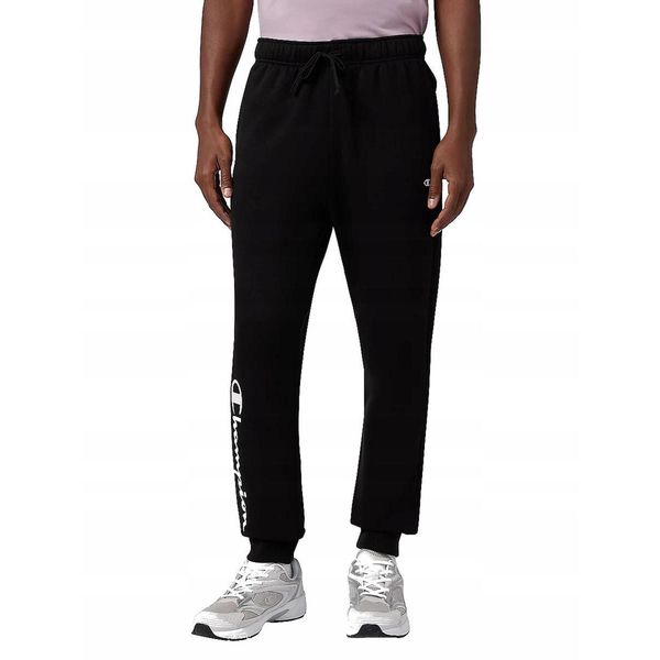 SPODNIE męskie CHAMPION 221812-KK001 dresowe sportowe dresy czarne L. Czarne spodnie sportowe męskie Champion, l, bez wzorów, z dresówki. Za 189.00 zł.