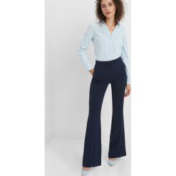 Taliowana koszula. Niebieskie koszule damskie Orsay, z bawełny, klasyczne, z klasycznym kołnierzykiem. Za 59.99 zł.