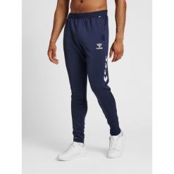 Spodnie joggingowe Hummel hmlCORE. Niebieskie krótkie spodenki sportowe męskie Hummel, m, bez wzorów, z materiału, na fitness i siłownię. Za 177.50 zł.