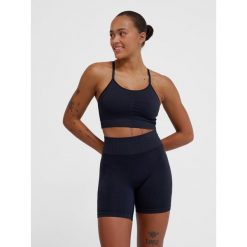 Bezszwowy biustonosz dla kobiet Hummel MT Define. Czarne koszulki sportowe damskie Hummel, bez wzorów, z tkaniny, bez kołnierzyka, bez ramiączek, do piłki nożnej. Za 193.00 zł.