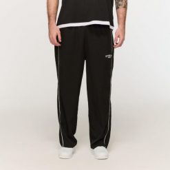 Spodnie męskie fitness oversize z szerokimi nogawkami Varsity czarne. Czarne spodnie sportowe męskie GYMBEAM, m, bez wzorów, z bawełny, na fitness i siłownię. Za 126.90 zł.
