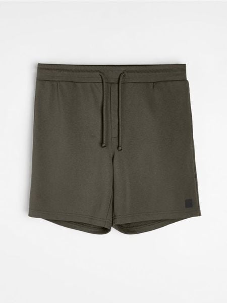 Szorty dresowe z wiązaniem - khaki. Brązowe szorty męskie Sinsay, l, bez wzorów, z dresówki. W wyprzedaży za 19.99 zł.