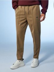 Spodnie tapered fit - beżowy. Brązowe spodnie materiałowe męskie Sinsay, l, bez wzorów. Za 69.99 zł.