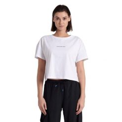 Koszulka damska top bawełniany sportowy okrągły dekolt Arena Crop Top. Białe koszulki sportowe damskie Arena, bez wzorów, z bawełny, bez kołnierzyka, bez ramiączek. Za 129.99 zł.