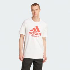 Koszulka Benfica Seasonal Graphic. Białe koszulki sportowe męskie Adidas, l, bez wzorów, z bawełny, bez kołnierzyka, bez ramiączek, do piłki nożnej. Za 161.65 zł.