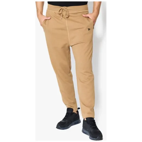 New Era Spodnie Originators Trk Pant Ne Khk , beżowy, rozmiar M. Brązowe spodnie sportowe męskie New Era, m, bez wzorów, z bawełny, na fitness i siłownię. W wyprzedaży za 149.99 zł.
