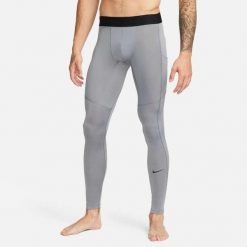 Legginsy męskie Nike Dri-FIT Fitness Tights. Szare legginsy sportowe męskie Nike, m, bez wzorów, z poliesteru, na fitness i siłownię, dri-fit (nike). Za 188.50 zł.
