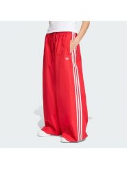 Adidas Spodnie dresowe Firebird Adilenium KD6299 Czerwony Regular Fit. Czerwone spodnie dresowe damskie Adidas, m, bez wzorów, z dresówki. Za 399.99 zł.