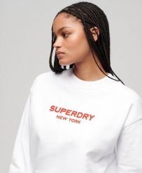 Luźny sweter z okrągłym dekoltem Sport Luxe. Białe swetry damskie Superdry., bez wzorów, z bawełny, sportowe, bez kołnierzyka, bez ramiączek, bez kaptura. Za 272.40 zł.