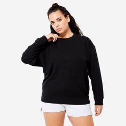 Bluza damska Domyos Gym & Pilates oversize. Czarne bluzy damskie DOMYOS, xl, bez wzorów, z bawełny, bez kaptura. W wyprzedaży za 59.99 zł.