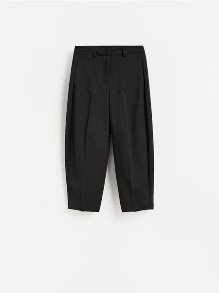 Spodnie z kantem - czarny. Czarne spodnie materiałowe damskie Reserved, l, bez wzorów, z bawełny. Za 139.99 zł.