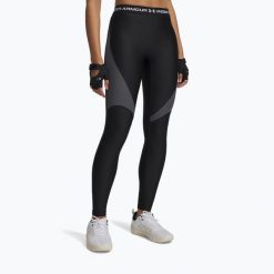 Legginsy Under Armour HeatGear Rib. Czarne legginsy damskie Under Armour, bez wzorów, na fitness i siłownię. Za 189.99 zł.