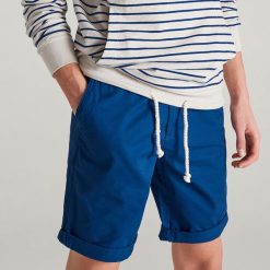 Bawełniane szorty chino - Niebieski. Spodnie materiałowe męskie Reserved. W wyprzedaży za 39.99 zł.