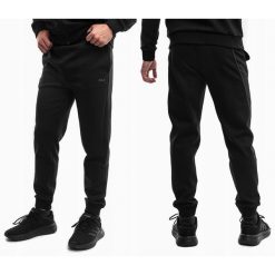 Spodnie Dresowe Męskie Fila Sportowe Dresy Treningowe Bawełniane. Czarne spodnie sportowe męskie Fila, m, bez wzorów, z bawełny. Za 235.00 zł.