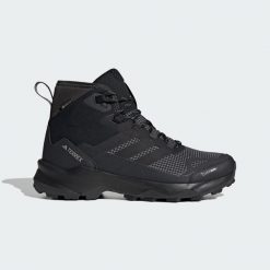 Buty trekkingowe Terrex Skychaser AX5 Mid GORE-TEX CLIMAWARM+. Czarne trekkingi męskie Adidas, wspinaczkowe, climawarm (adidas). Za 699.00 zł.