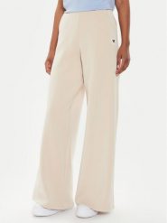 Guess Spodnie dresowe V4YB07 KCAY2 Beżowy Relaxed Fit. Brązowe spodnie dresowe damskie Guess, xl, z aplikacjami, z dresówki. Za 269.99 zł.