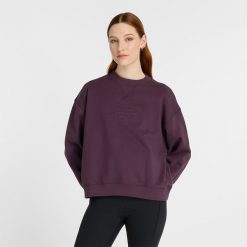 Bluza damska New Balance WT43535PLN – fioletowa. Fioletowe bluzy damskie New Balance, l, bez wzorów, z bawełny, bez kaptura. Za 199.99 zł.