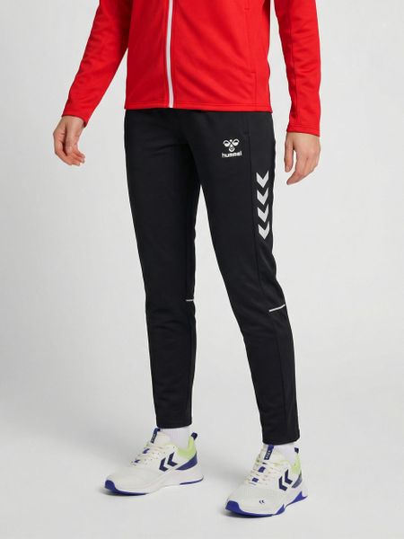 Damskie spodnie dresowe Hummel Core 2.0 Woven. Białe spodnie dresowe damskie Hummel, l, bez wzorów, z dresówki, na fitness i siłownię. Za 231.00 zł.