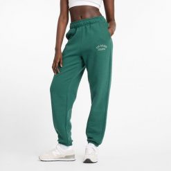 Spodnie damskie New Balance WP43500NWG – zielone. Zielone spodnie dresowe damskie New Balance, s, z aplikacjami, z bawełny. Za 299.99 zł.