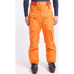 Spodnie narciarskie męskie SPMN553 - pomarańcz. Brązowe spodnie snowboardowe męskie 4f, m, bez wzorów, z materiału, narciarskie. W wyprzedaży za 149.99 zł.