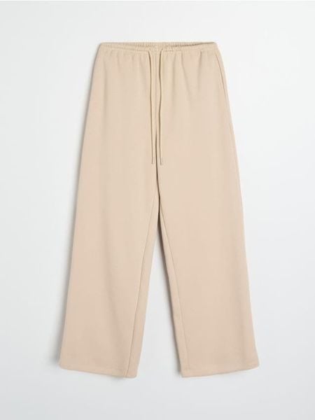 Spodnie straight leg - kremowy. Białe spodnie materiałowe damskie Sinsay, l, bez wzorów. Za 49.99 zł.