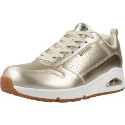 Buty SKECHERS UNO - METALLIXS Złoty. Żółte obuwie sportowe damskie Skechers, bez wzorów, ze skóry ekologicznej. Za 446.09 zł.