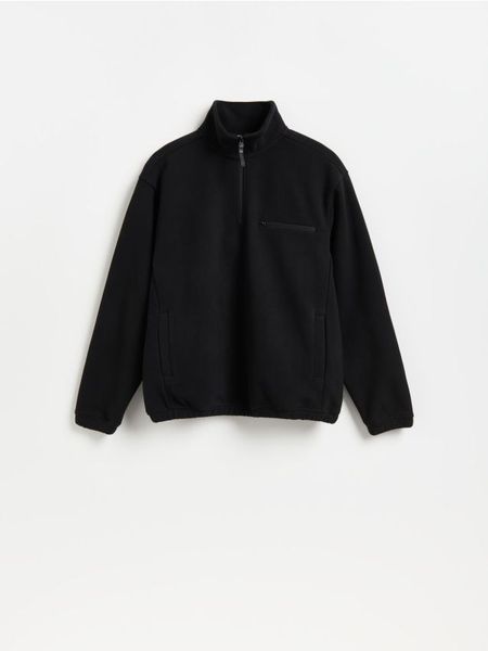 Polarowa bluza ze stójką - czarny. Czarne bluzy męskie Reserved, l, bez wzorów, z polaru, bez kaptura. Za 129.99 zł.