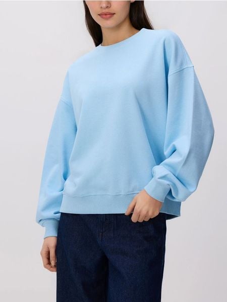 Gładka bluza z bawełną - jasnoniebieski. Niebieskie bluzy damskie Reserved, l, bez wzorów, z bawełny, bez kaptura. Za 89.99 zł.