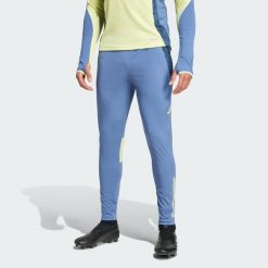 Spodnie Ajax Amsterdam Tiro 24 Competition Training. Niebieskie spodnie sportowe męskie Adidas, xl, bez wzorów, z dresówki, do piłki nożnej. W wyprzedaży za 209.30 zł.