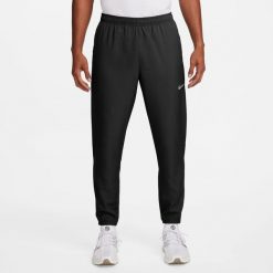 Męskie spodnie M NK DF CHALLENGR WVN PANT. Czarne spodnie sportowe męskie Nike, m, bez wzorów, z materiału, do biegania, dri-fit (nike). Za 337.95 zł.
