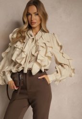 Beżowa Koszula z Wiskozą Zdobiona Falbanami i Wiązaniem przy Szyi Ravissa. Brązowe bluzki damskie Renee, na lato, m, z aplikacjami, z wiskozy, eleganckie, bez kołnierzyka, bez ramiączek. Za 159.99 zł.