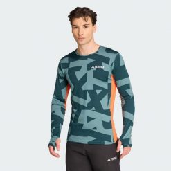 Koszulka z długim rękawem Multi Synthetic Base Layer. Niebieskie bluzki z długim rękawem męskie Adidas, m, bez wzorów, bez kołnierzyka. Za 219.00 zł.