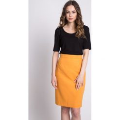Klasyczna musztardowa spódnica z podszewką BIALCON. Czarne spódnice damskie BIALCON, na wiosnę, bez wzorów, eleganckie, koszulowe. W wyprzedaży za 122.00 zł.