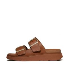 Damskie sandały na koturnie FitFlop Gen-FF. Brązowe sandały damskie FIT FLOP, bez wzorów, ze skóry, bez obcasa, na koturnie, bez zapięcia. Za 678.50 zł.