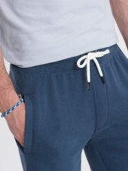 Ombre Męskie spodenki dzianinowe ze ściągaczem i kieszeniami - ciemnoniebieskie V4 OM-SRBS-0139 XL. Niebieskie krótkie spodenki sportowe męskie Ombre, m, bez wzorów, z dzianiny. Za 49.99 zł.