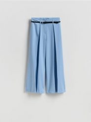 Spodnie z zakładkami - jasnoniebieski. Niebieskie spodnie materiałowe damskie Reserved, l, bez wzorów, z tkaniny. Za 159.99 zł.