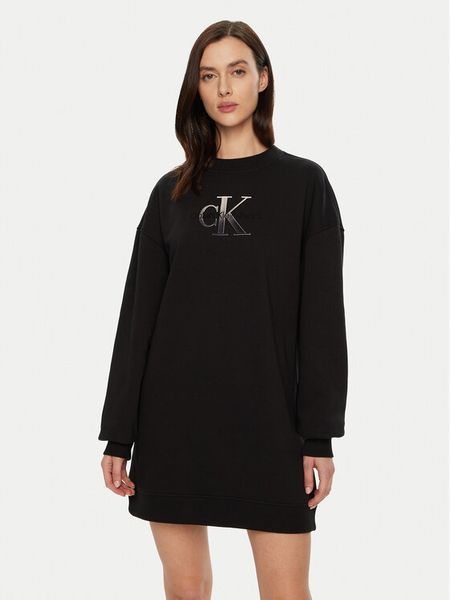 Calvin Klein Jeans Sukienka dzianinowa J20J224834 Czarny Relaxed Fit. Czarne sukienki damskie Calvin Klein Jeans, xs, bez wzorów, z bawełny, bez kołnierzyka, bez ramiączek. Za 259.99 zł.