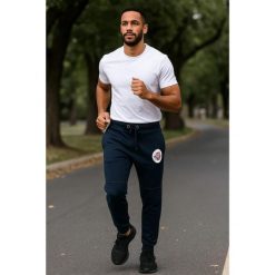 Geographical Norway Jogging Pant MIRABEL MEN 100 EO-PR+BS (SU1204H/GN/Navy). Niebieskie spodnie sportowe męskie Geographical Norway, na lato, bez wzorów, do biegania. Za 109.00 zł.