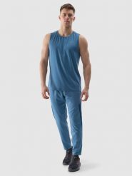 4F Spodnie treningowe szybkoschnące męskie - niebieskie L. Niebieskie spodnie sportowe męskie 4f, l, bez wzorów, z dzianiny, na fitness i siłownię. W wyprzedaży za 79.99 zł.