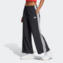 Spodnie damskie ADIDAS. Czarne spodnie materiałowe damskie Adidas, m, bez wzorów, z poliamidu. Za 219.99 zł.