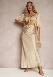 Beżowy Komplet Spódnica Wykończona Gumką w Pasie Top z Ozdobnym Sznurowaniem Dimetria. Brązowe spódnice damskie Renee, uniwersalny, bez wzorów, z jeansu, eleganckie, dopasowane. Za 99.99 zł.