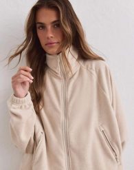 Damska kurtka polarowa na zamek Fleece Zip piaskowa. Brązowe kurtki sportowe damskie Aim'n, l, bez wzorów, z materiału, bez kaptura, trekkingowe. Za 430.00 zł.