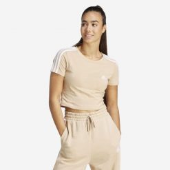 Koszulka damska ADIDAS Gym & Pilates crop slim. Białe koszulki sportowe damskie Adidas, l, bez wzorów, z bawełny, bez kołnierzyka, bez ramiączek, na fitness i siłownię. Za 99.99 zł.