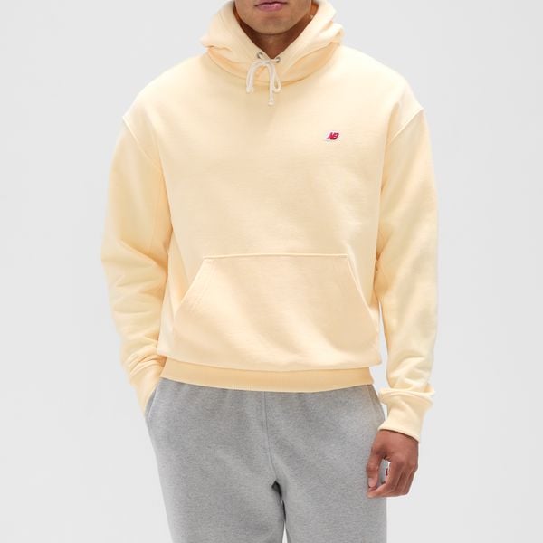 Bluza męska New Balance MADE in USA MT43546CAU – żółta. Żółte bluzy męskie New Balance, l, bez wzorów, z bawełny, z kapturem. Za 829.99 zł.