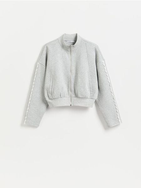 Bluza z ażurowymi wstawkami - jasnoszary. Szare bluzy damskie Reserved, l, w ażurowe wzory, z bawełny, bez kaptura. Za 99.99 zł.