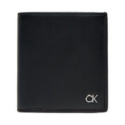 Portfel Calvin Klein. Czarne portfele męskie Calvin Klein, bez wzorów. Za 399.99 zł.