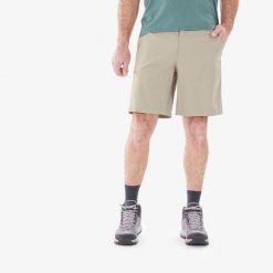 Spodenki turystyczne męskie Quechua MH100. Brązowe krótkie spodenki sportowe męskie QUECHUA, l, bez wzorów, z materiału, trekkingowe. Za 59.99 zł.