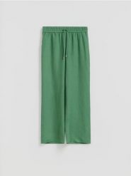 Luźne spodnie z lnem - zielony. Zielone spodnie materiałowe damskie Reserved, l, bez wzorów, z wiskozy. Za 129.99 zł.